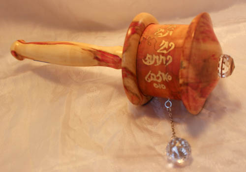 Custom buddhist prayer wheel with microfilm.